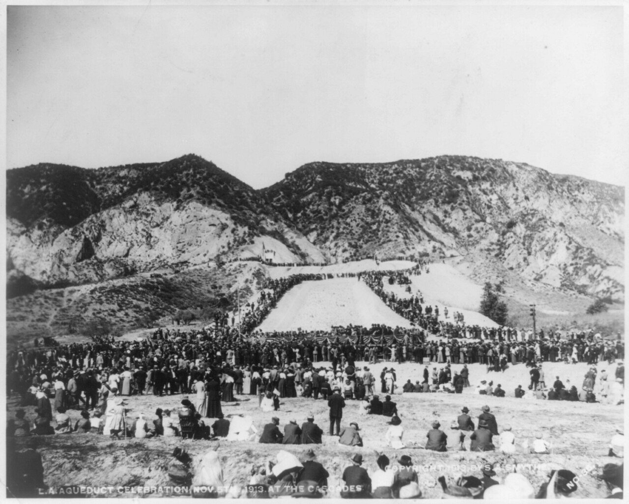 A crowd of several thousand covering the hillside at the Cascades on November 5, 1913, watching the first Owens Valley water arrive.