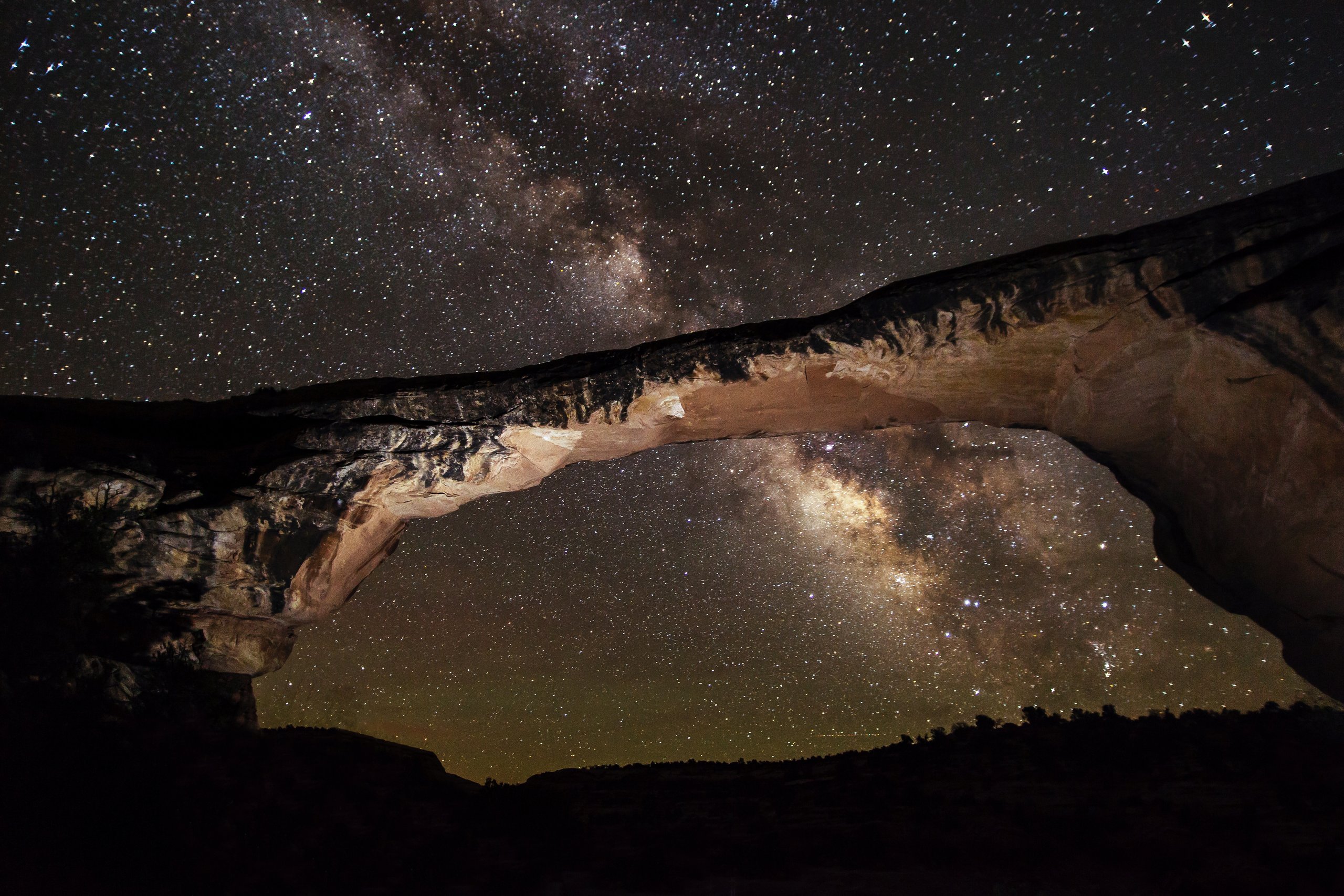 The Milky Way arching over Owachomo Bridge at Natural Bridges National Monument, Utah — the world's first International Dark Sky Park.