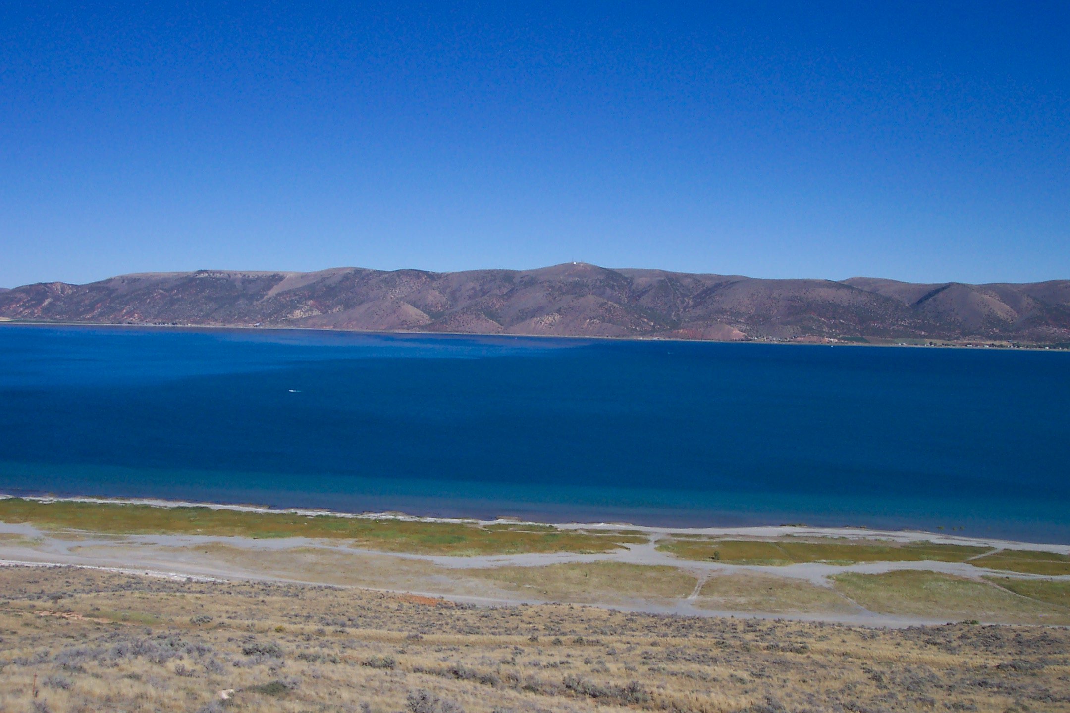 The turquoise water of Bear Lake on the Utah–Idaho line, its Caribbean color owed to limestone sediment suspended in the water.