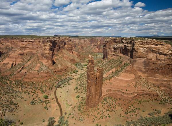 Spider Rock, the roughly 800-foot sandstone spire at the fork of Canyon de Chelly on the Navajo Nation, seen from the rim overlook.