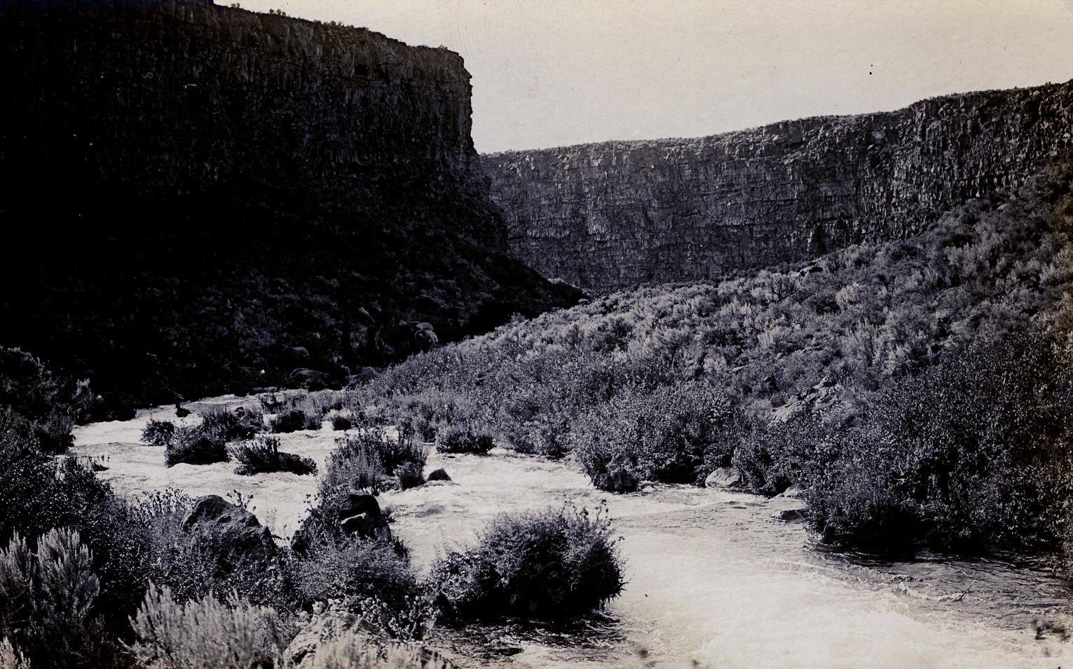Box Canyon near Wendell in a real-photo postcard of about 1915, its spring creek running between sheer basalt walls