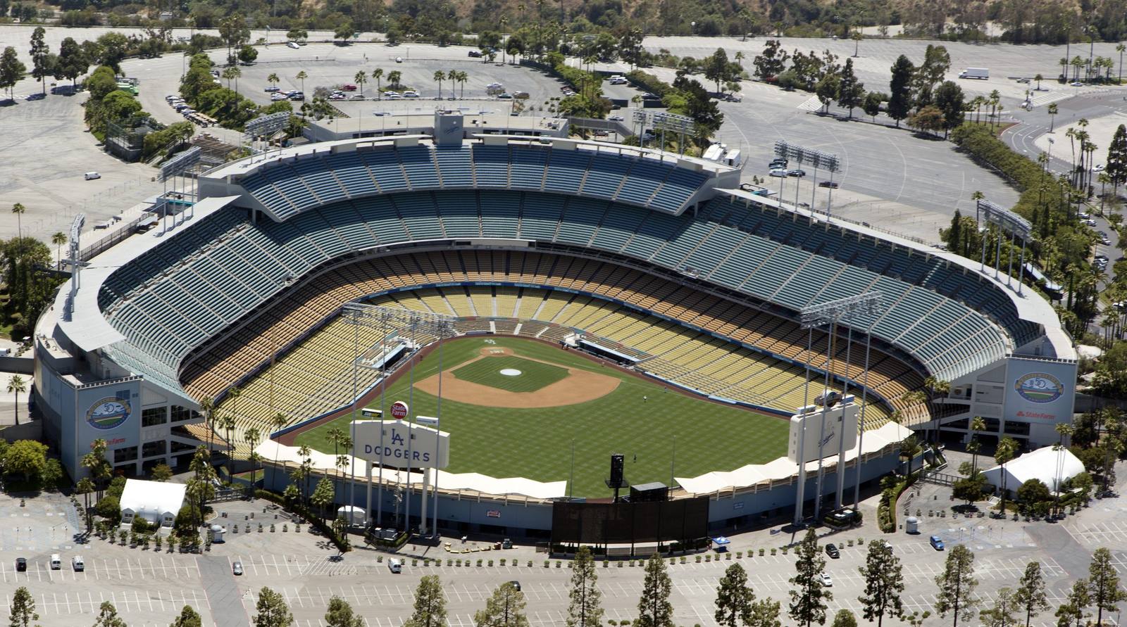 Aerial view of Dodger Stadium ringed by its parking lots in Chavez Ravine, on the ground where Palo Verde, La Loma and Bishop once stood