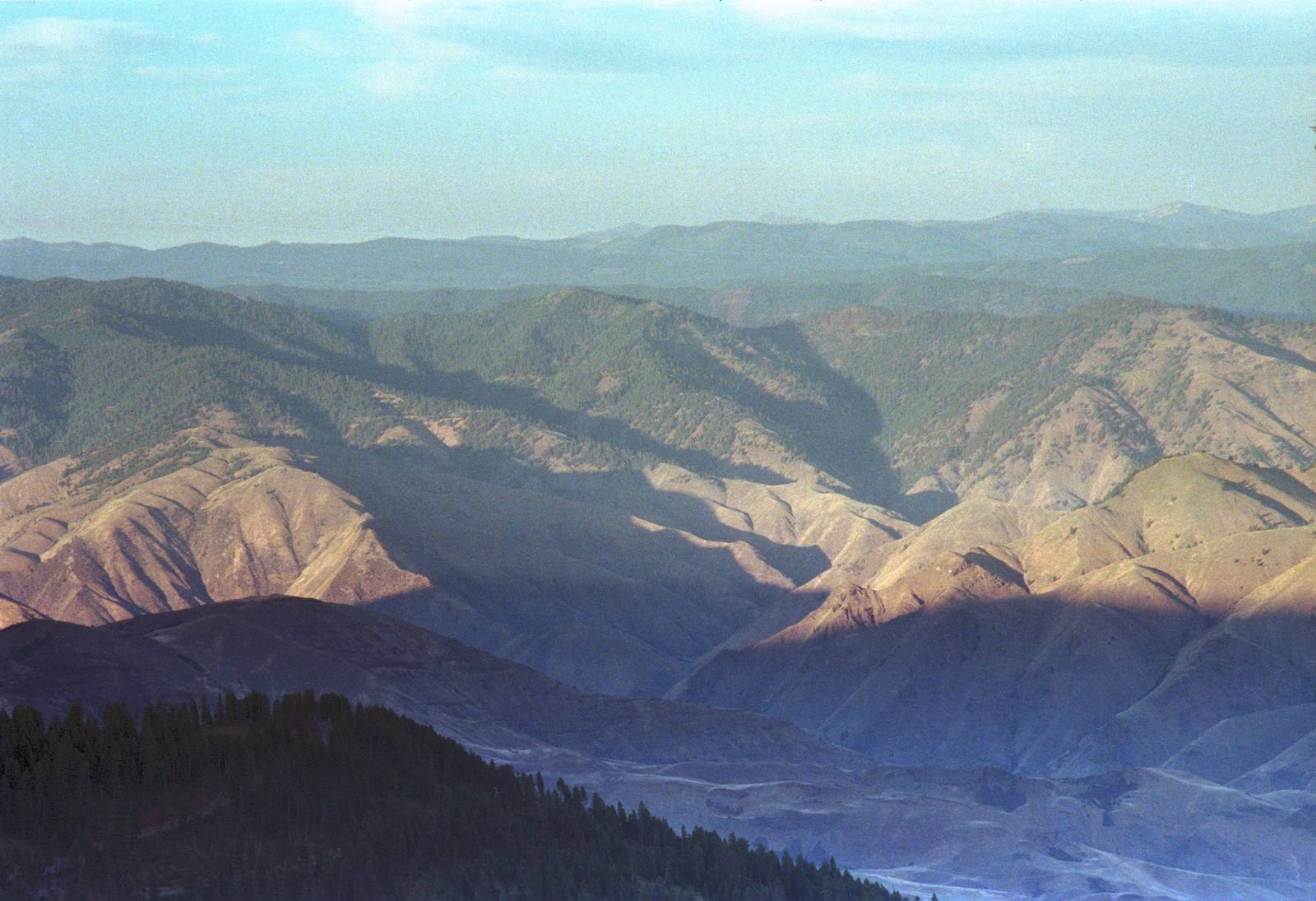 Layered ridges and deep canyon country seen from the summit at Heavens Gate