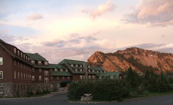 Crater Lake Lodge on the caldera rim at dusk, Garfield Peak glowing behind it