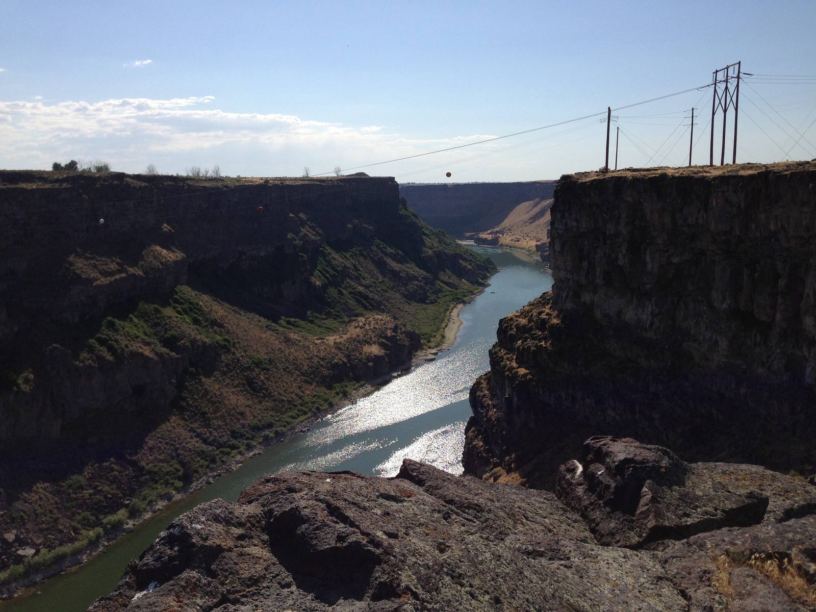 The Snake River running west between basalt cliffs below Shoshone Falls