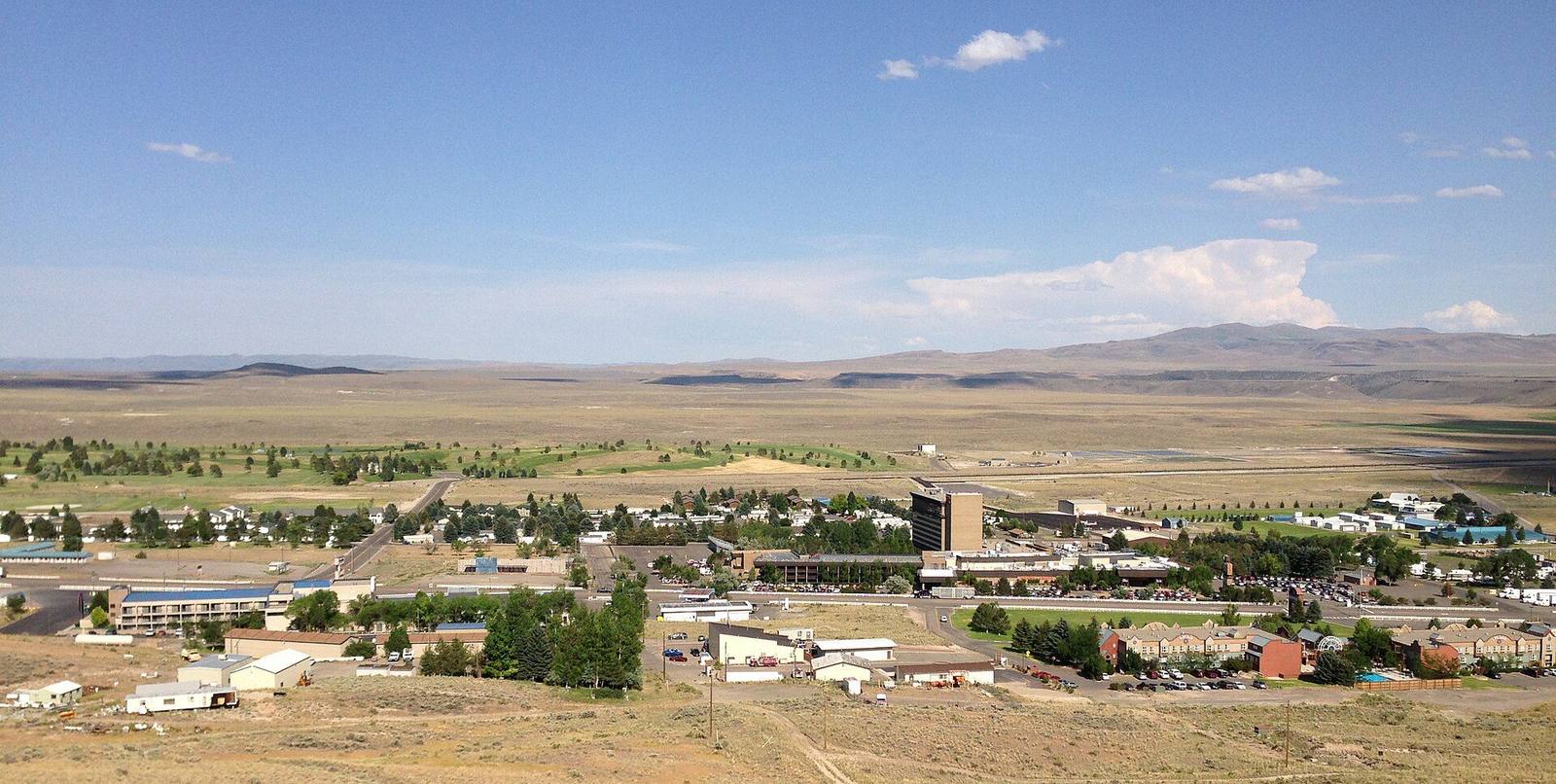 Jackpot's casinos and houses spread across the sagebrush valley, seen from a hill to the west