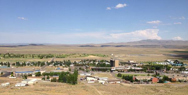 Jackpot's casinos and houses spread across the sagebrush valley, seen from a hill to the west