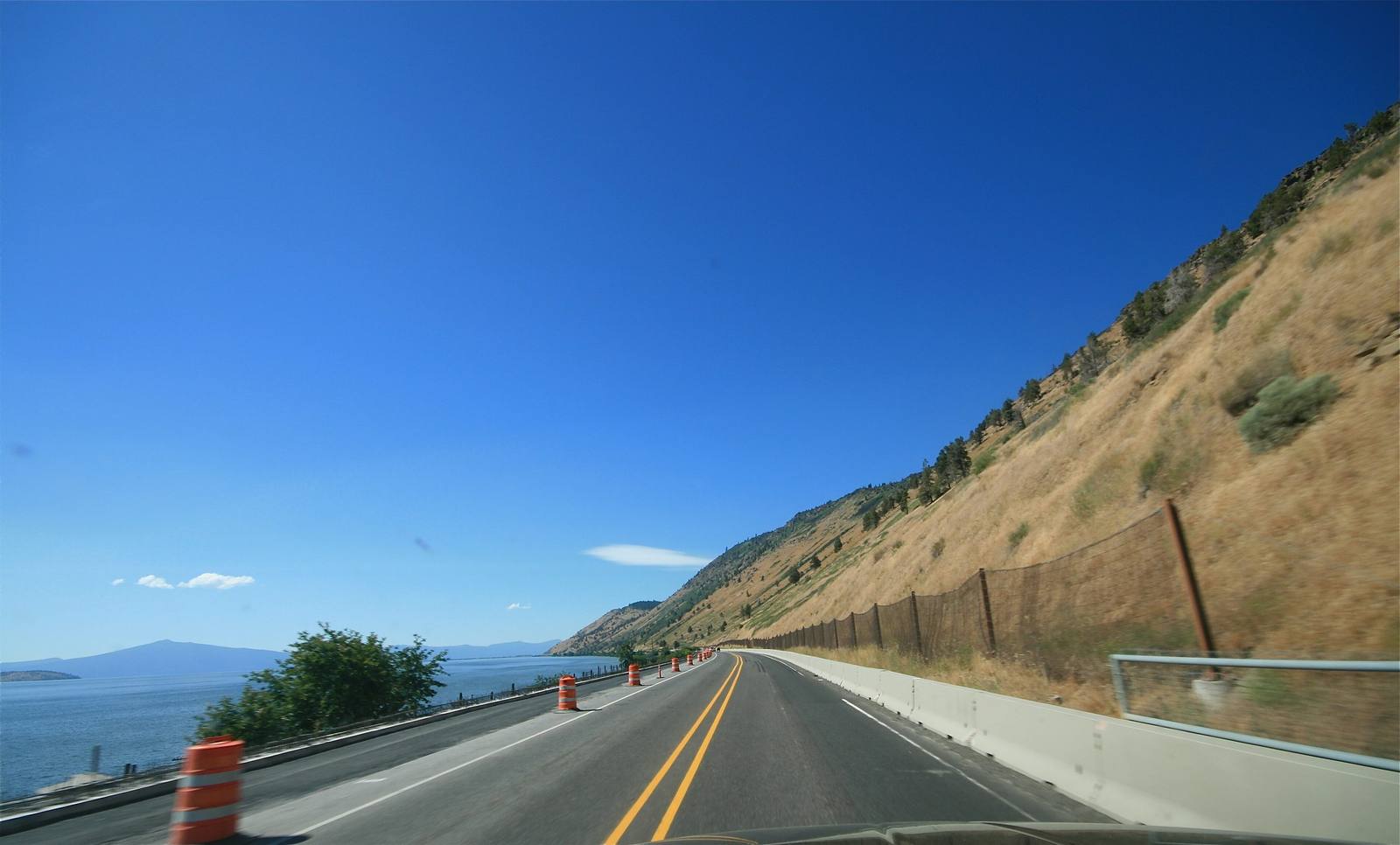 US-97 running along a dry hillside above the east shore of Upper Klamath Lake