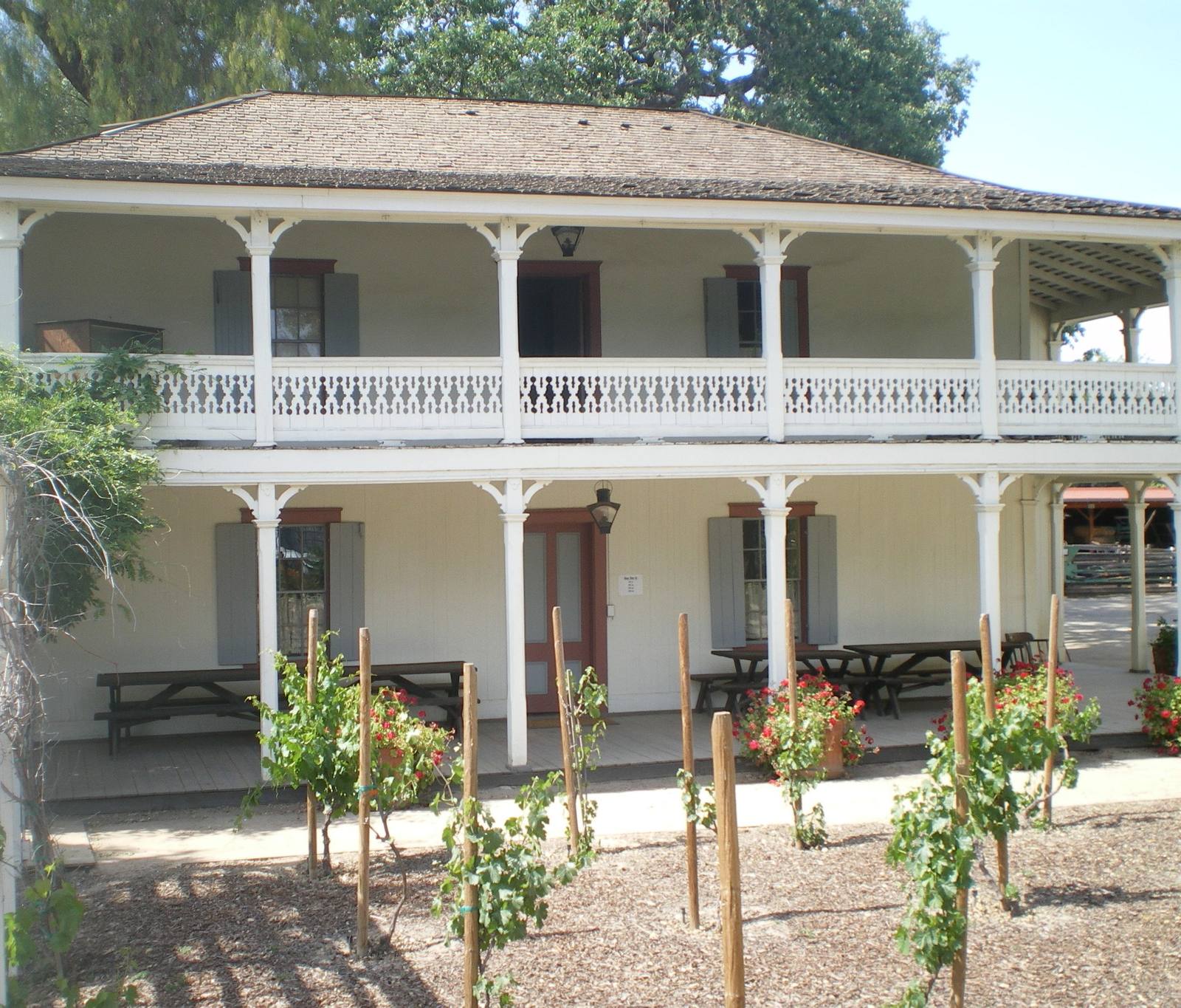 The two-storey Monterey-style Leonis Adobe in Calabasas, its balcony running the length of the front veranda.