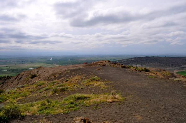 The trail along the crater rim of North Menan Butte, with farmland on the plain far below