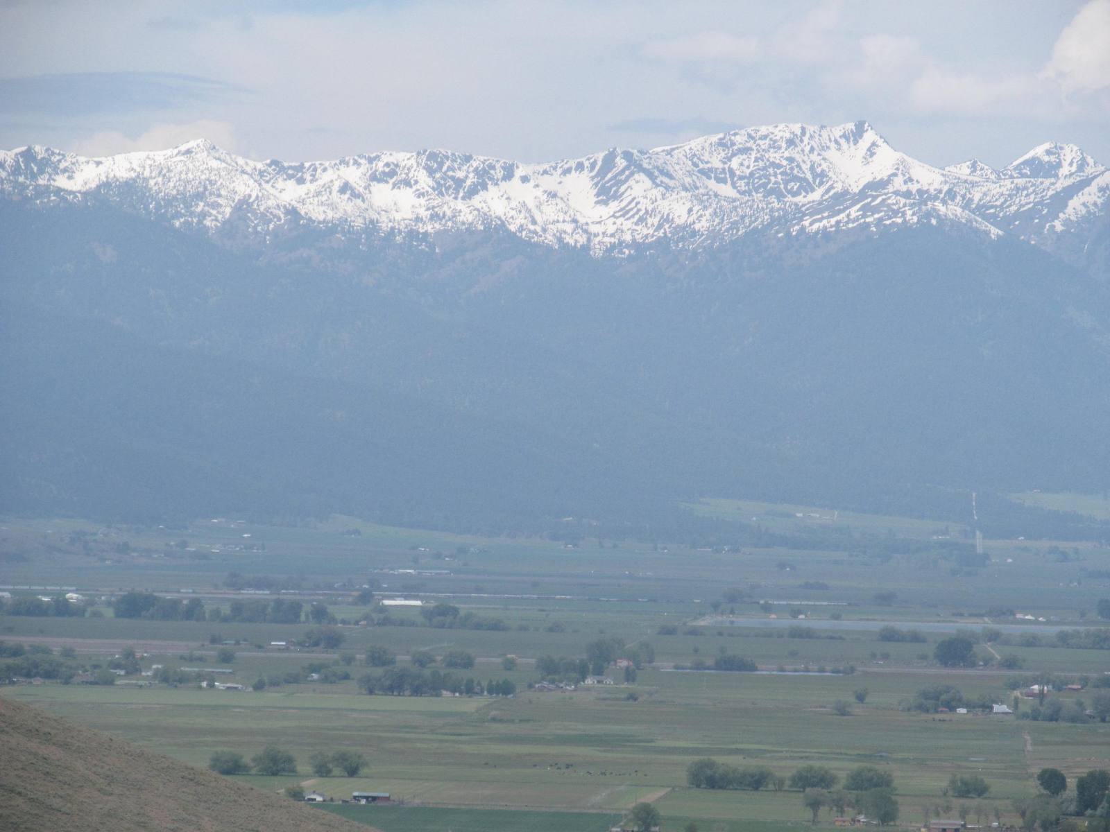 Snow on the Blue Mountains above the farms of the Baker Valley near Baker City