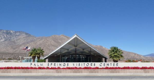 The Palm Springs Visitors Center — the 1965 Tramway Gas Station by Albert Frey and Robson Chambers — its cantilevered wedge roof against the bare slopes of Mount San Jacinto.
