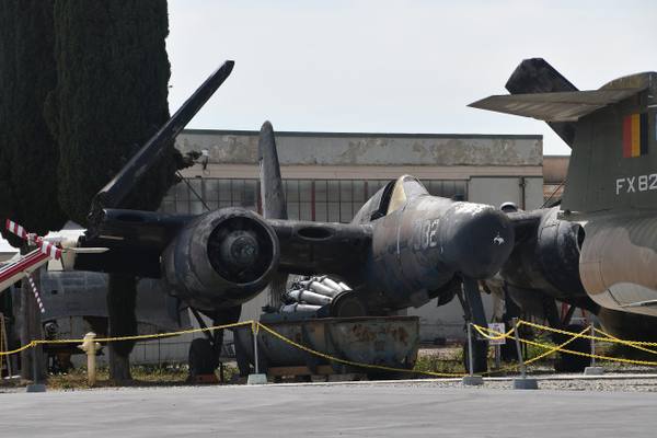 A Grumman F7F Tigercat parked nose-on among other aircraft outdoors at Planes of Fame in Chino.