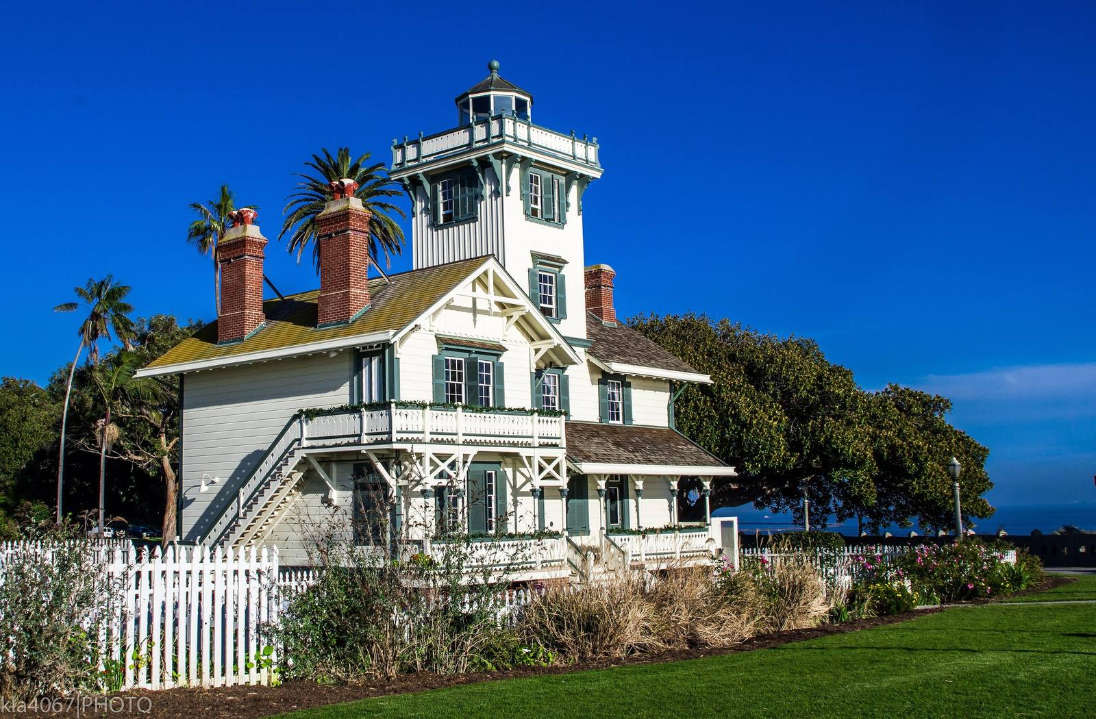Point Fermin Lighthouse, a Stick Style Victorian house with a lantern room rising from its roof, on the bluff above San Pedro.
