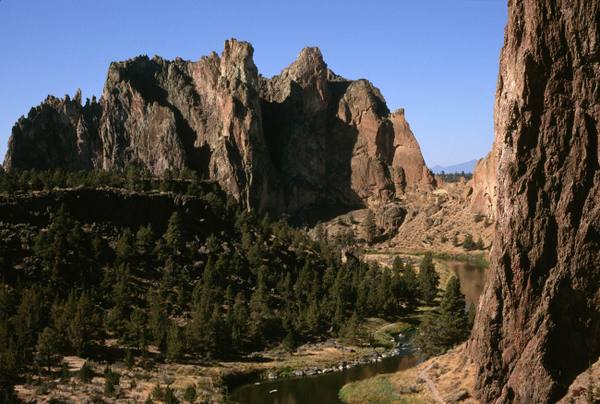 The tuff spires of Smith Rock above junipers and the Crooked River