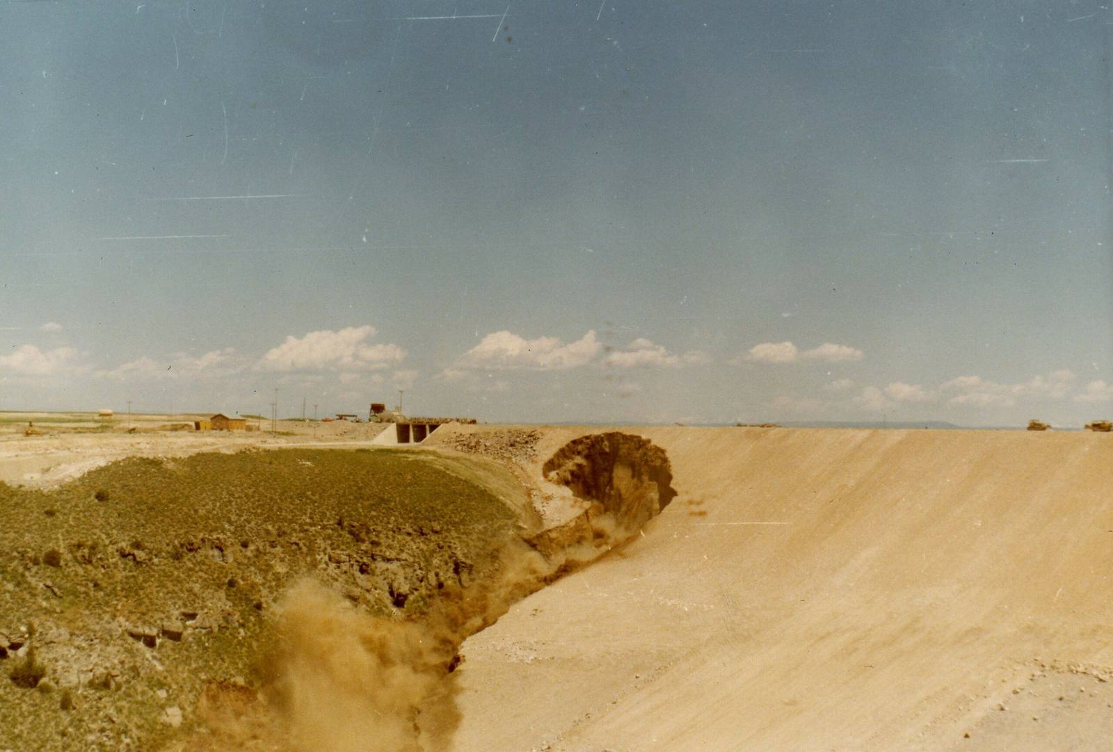 Water cutting through the face of the Teton Dam embankment on June 5, 1976, the day it failed