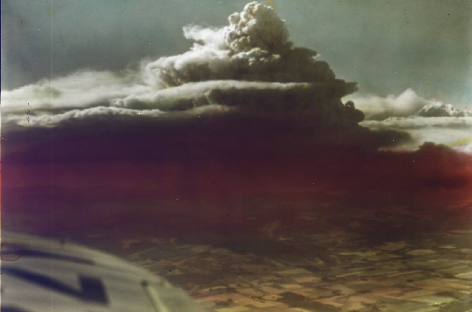 The smoke column of the 1933 Tillamook fire towering over the Coast Range, photographed from an airplane