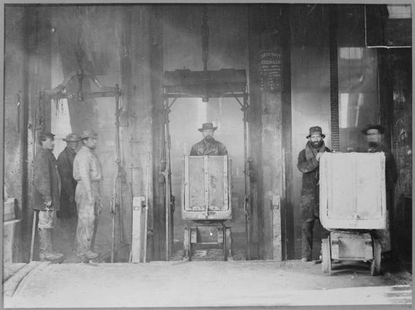 An 1867-68 photograph of ore cars emerging from a Comstock mine shaft at Virginia City, Nevada.