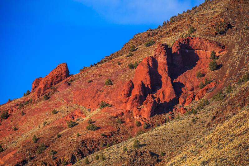 Red rock outcrops on a sage and juniper slope in the Hart Mountain National Antelope Refuge