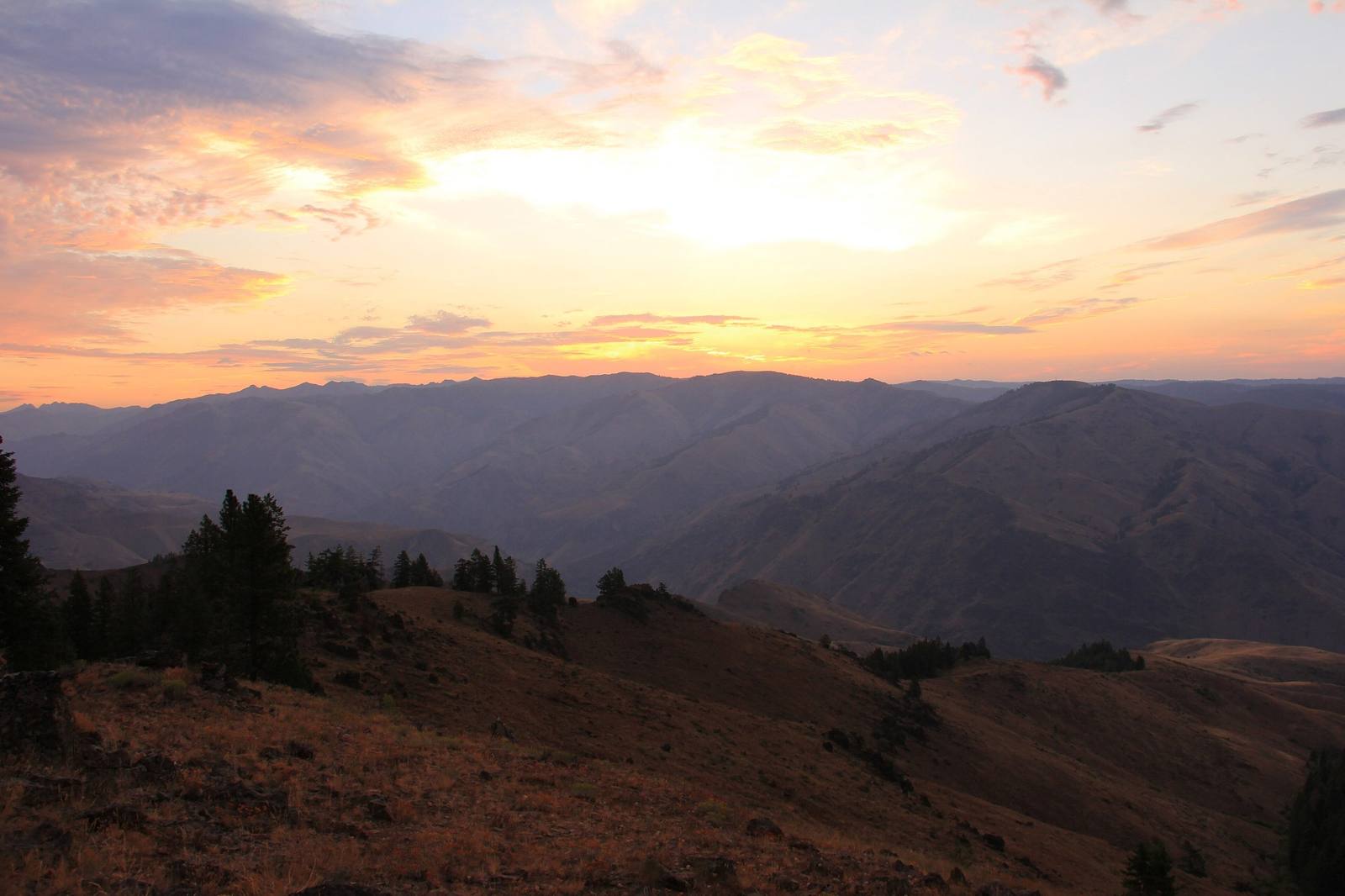 Ridges of Hells Canyon fading into haze at sunrise