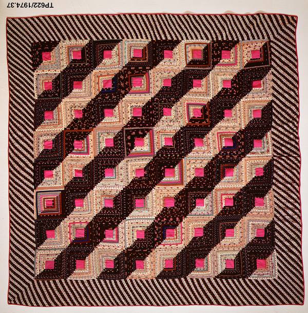 A mid-19th-century American pieced quilt in the Log Cabin pattern — the patchwork tradition behind the name of Scenic Byway 143, the "Patchwork Parkway."