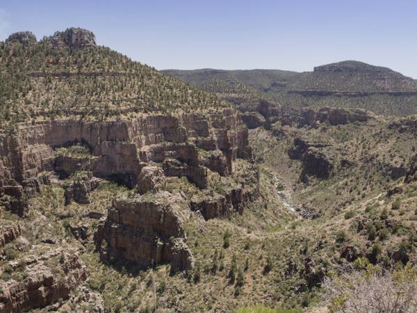 The banded gorge of Salt River Canyon, where the highway drops off the Mogollon Rim toward the Salt River in the Apache high country of eastern Arizona.