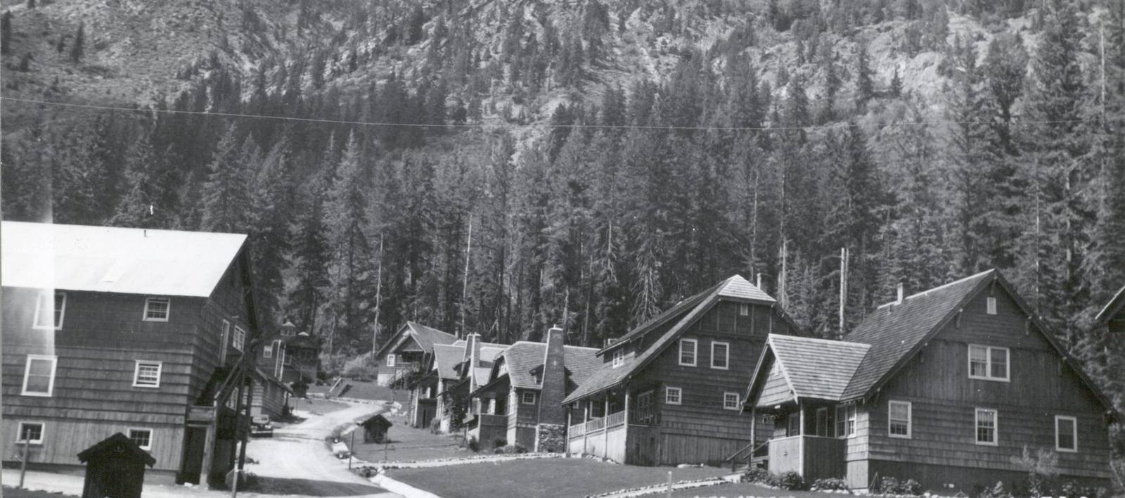 Holden in the late 1930s, the mining company's shingled houses and dormitories lining a dirt street below a steep forested slope
