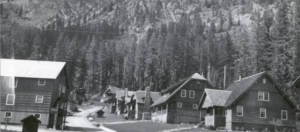 Holden in the late 1930s, the mining company's shingled houses and dormitories lining a dirt street below a steep forested slope