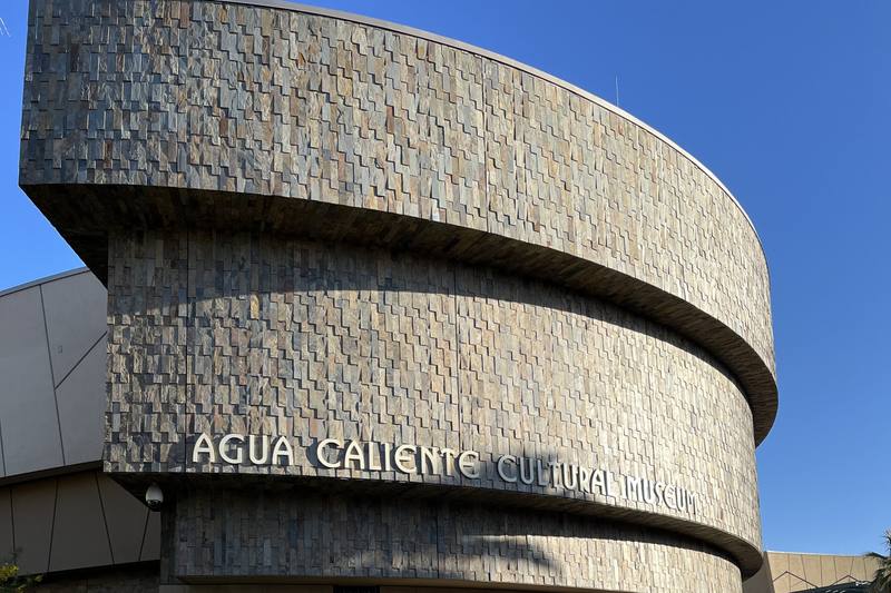 The curved stone facade of the Agua Caliente Cultural Museum, its name in metal letters, at the tribe's Cultural Plaza on Section 14 in downtown Palm Springs.
