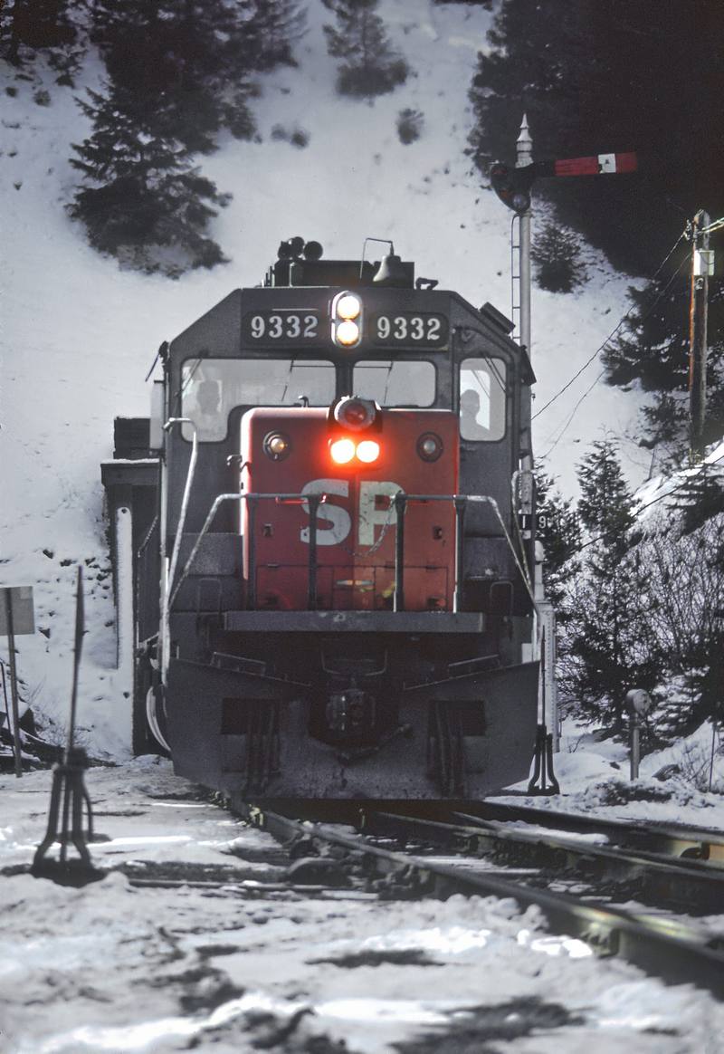 A Southern Pacific freight in snow at the Siskiyou Summit tunnel in 1979, the line where Train 13 was stopped in 1923