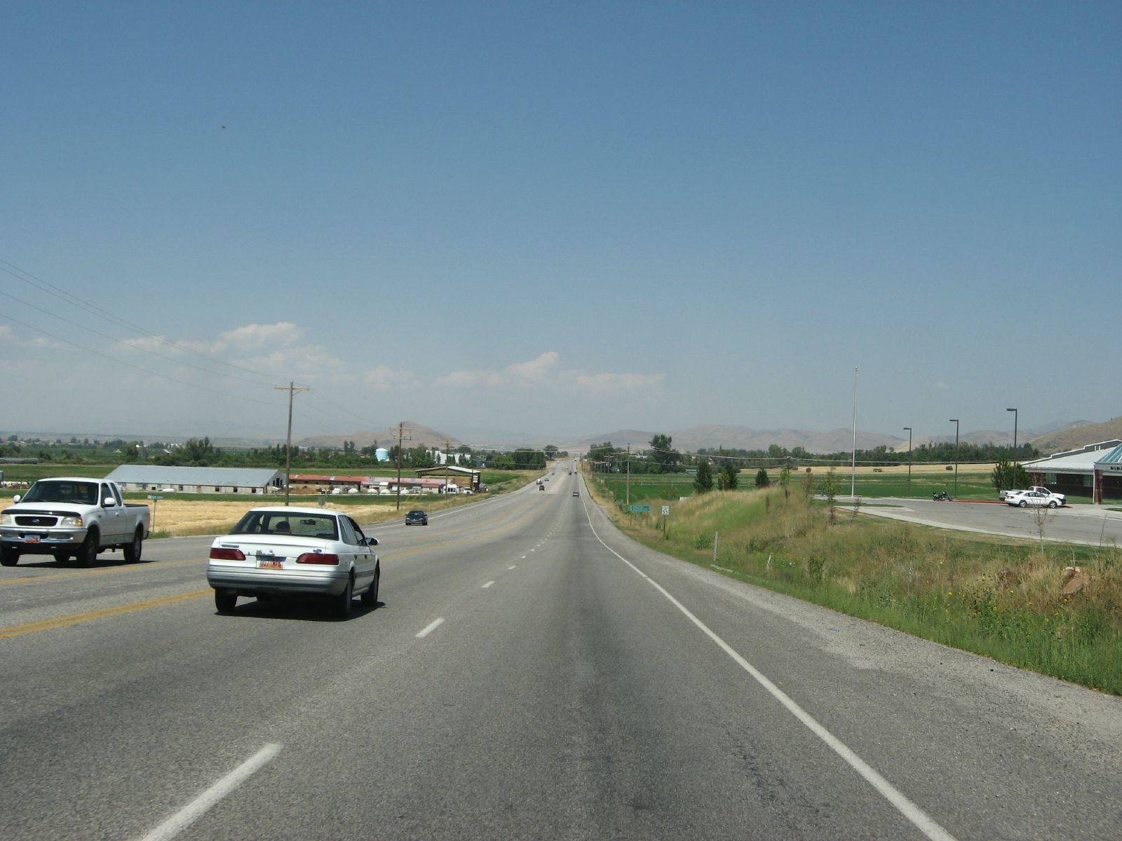 U.S. 91 running north across Cache Valley farmland near the Idaho-Utah line