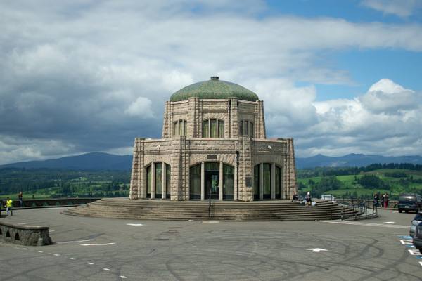 Vista House, the domed stone octagon on Crown Point, under a broken sky