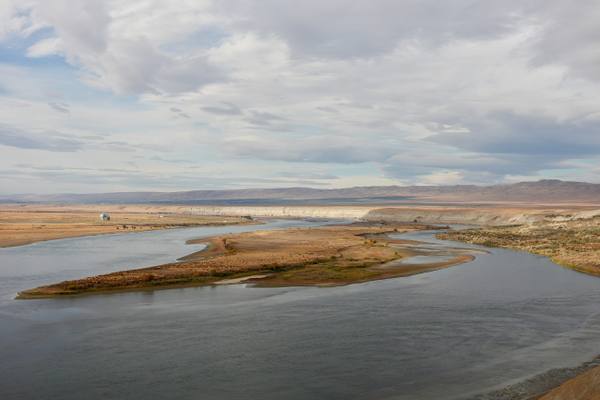 The free-flowing Columbia in the Hanford Reach, bending around gravel bars below pale bluffs